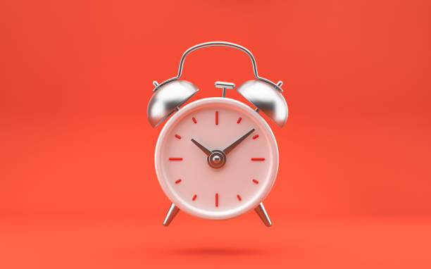 istock White and silver metal vintage alarm clock on bright red background. Modern design, 3d rendering. 1363876511