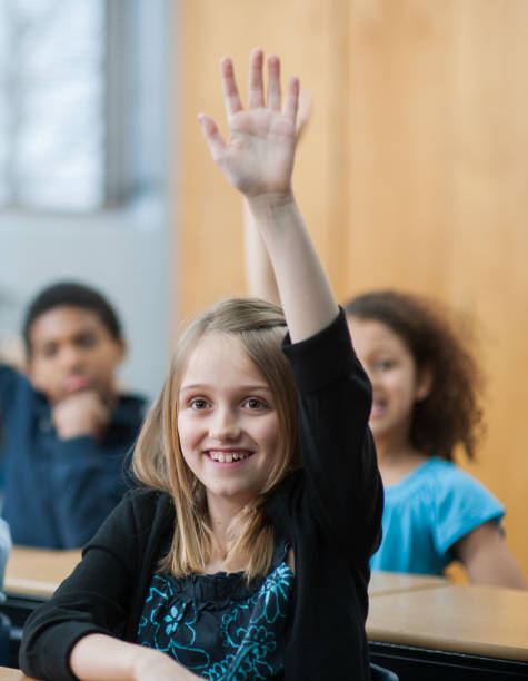 istock Child rasies her hand 1363879146