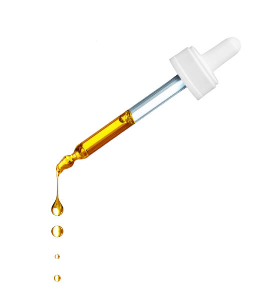 istock Drops falls from a medicinal cosmetic pipette, isolated on a white background 1363883394