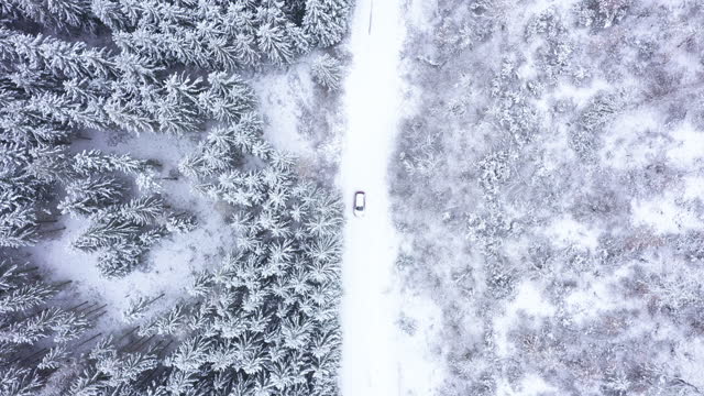 Car driving on winter country road