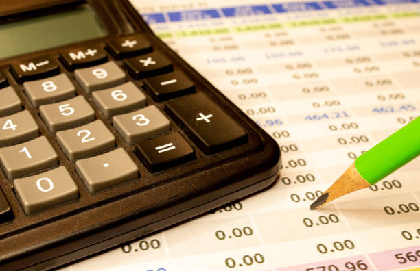 istock close up calculator with pen on white paper 1363886175