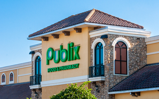 St. Augustine, Florida, USA- December 30, 2021- The Spanish influenced architecture of the facade of the Publix Supermarket  in Cobblestone Village offers an eye pleasing view of the food store and pharmacy.