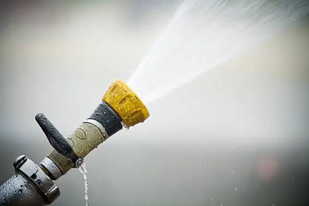 Photo of Fire hose shooting water out