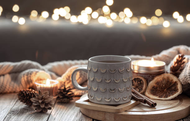 istock Beautiful christmas cup and candles on blurred background with bokeh. 1363890048