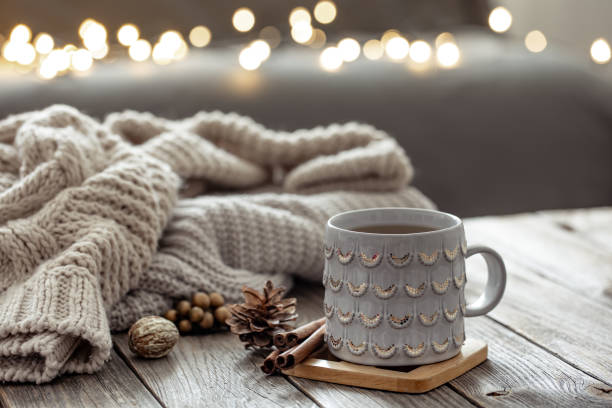 istock Beautiful christmas cup and candles on blurred background with bokeh. 1363890051