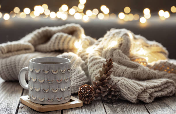 istock Beautiful christmas cup and candles on blurred background with bokeh. 1363890053