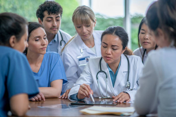 istock Diverse group of medical staff discussing 1363890682