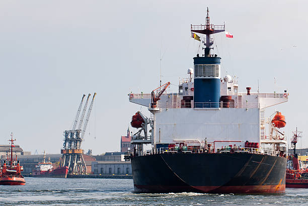 istock Big ship and tugboat assist. 136389129