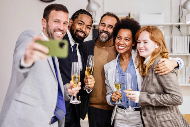 istock Business colleagues taking a selfie at birthday party at work 1363891764