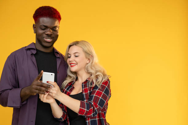 istock mobile entertainment gadget leisure man woman 1363894403