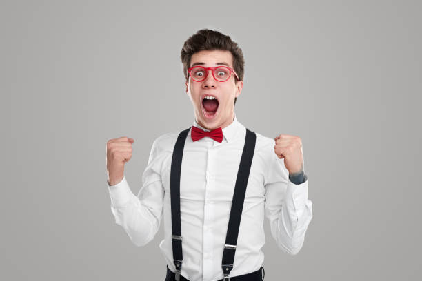 istock Funny male nerd celebrating victory 1363894492