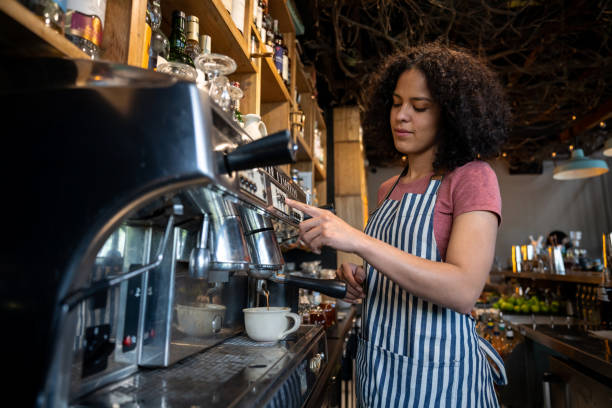 istock Barista working at a restaurant and making a cup of coffee 1363895175