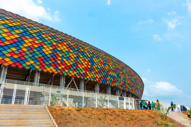 Yaoundé, Cameroon The Paul Biya Omnisports Stadium at Olembe which hosted the AFCON 2021 opening game on a sunny day. The stadium's main feature are the pangolin scales represented on the exterior surface yaounde photos stock pictures, royalty-free photos & images