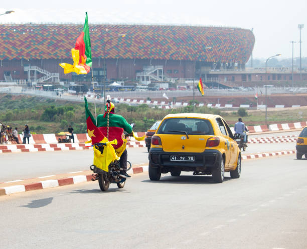 Yaoundé, Cameroon Fans moving to the stadium for the opening game of the 2021 edition of the African Cup of Nations with the hosts Cameroon facing Burkina Faso yaounde photos stock pictures, royalty-free photos & images