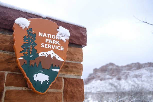 National Park Service Sign National Park Service sign with snow Zion national park stock pictures, royalty-free photos & images