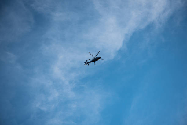 istock Helicopter fly in the blue sky 1363899058