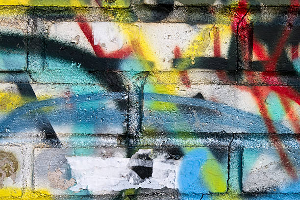 istock Old brick wall with a colorful graffiti on it 136390073