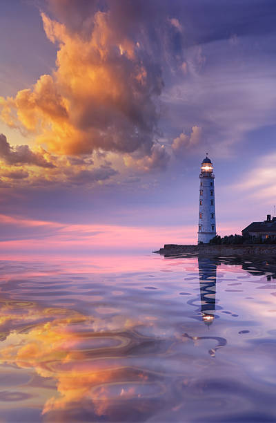 istock Beautiful seascape with a lighthouse at sunset 136390080