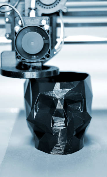 istock Abstract object of a black color printed by 3d printer. 1363901028