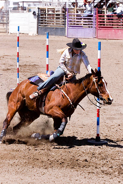 istock Cow-Girl Rodeo Pole Bending Competition Photo 136390141
