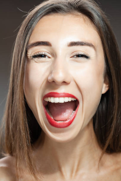 istock Beautiful brunette girl studio portrait. Screaming and surprised expression. 1363911237