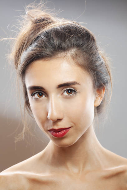 istock Beautiful brunette girl studio portrait. Smiling face expression. 1363911248