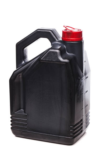 istock Plastic black canister for car engine motor oil with red cap. Isolated on white background.. 1363911345