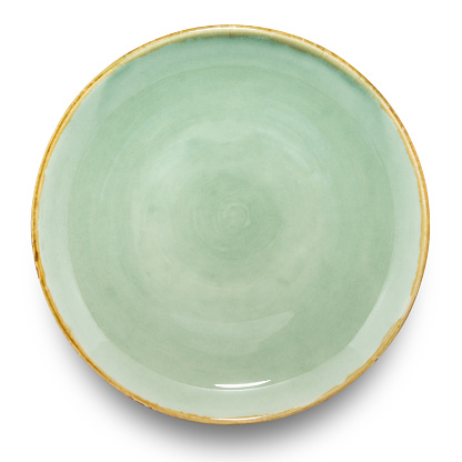 Empty green circle ceramics plate isolated on white background with clipping path.