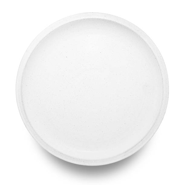 istock White circle ceramics plate isolated on white background. 1363914556