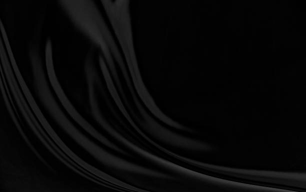 istock Black gray satin dark fabric texture luxurious shiny that is abstract silk cloth background with patterns soft waves blur beautiful. 1363914605