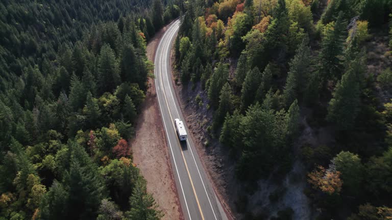 Hauling a Camper Trailer Up the Highway near Burney Mountain, CA