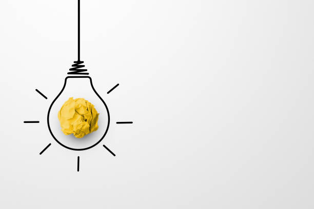Creative thinking ideas and innovation concept. Paper scrap ball yellow colour with light bulb symbol on white background