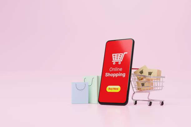 istock Online shopping concept. Web or mobile application ecommerce. Smartphone and carton paper box in shopping cart and shopping bag on pink background. 3d rendering 1363923918