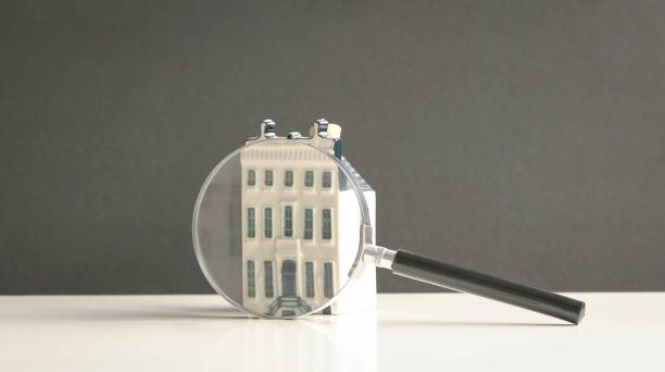 Search for property Mini property with magnifying glass. Search for property concept. commercial real estate stock pictures, royalty-free photos & images