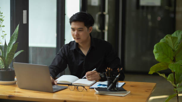 istock Businessman concentrated working on his project. 1363925715