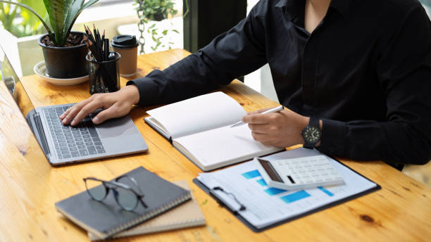 istock Male accountant doing his business assignment in the office. 1363925716