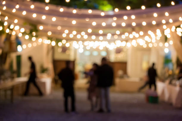 vintage tone blur image of food stall at night festival with bokeh for background usage. Festival Event Party with People Blurred Background. Blur people having sunset beach party in summer vacation vintage tone blur image of food stall at night festival with bokeh for background usage. Festival Event Party with People Blurred Background. Blur people having sunset beach party in summer vacation happy hour stock pictures, royalty-free photos & images