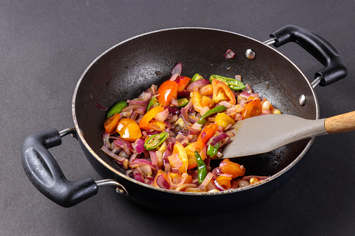 chopped vegetables in frying bowl or kadai