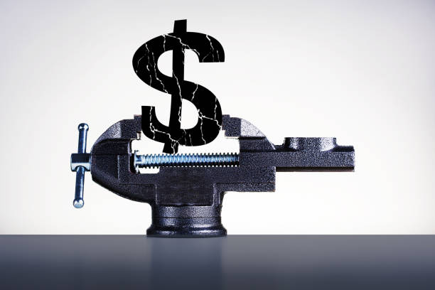 Crash dollar. Cracked dollar sign in vise on grey background.