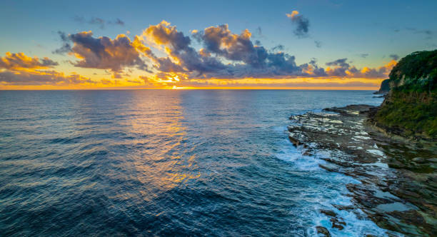 istock Aerial sunrise panorama over the sea with clouds 1363930694