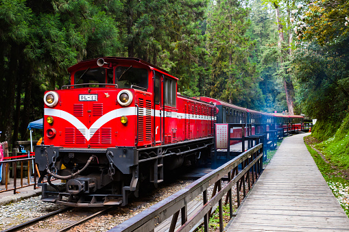 Red train head, train station in the mountains, small train in the mountains.