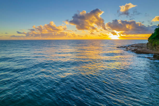 istock Aerial sunrise over the sea with clouds 1363931456