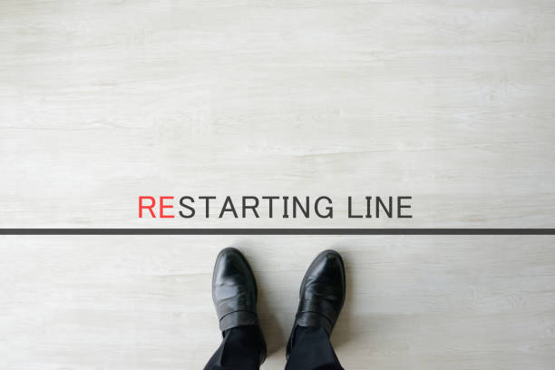 istock Business man standing by restarting line 1363935837