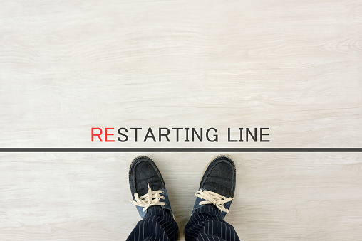 Man standing by restarting line