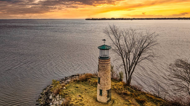 istock Old ancient lighthouse still watches over the water during sunset 1363945424