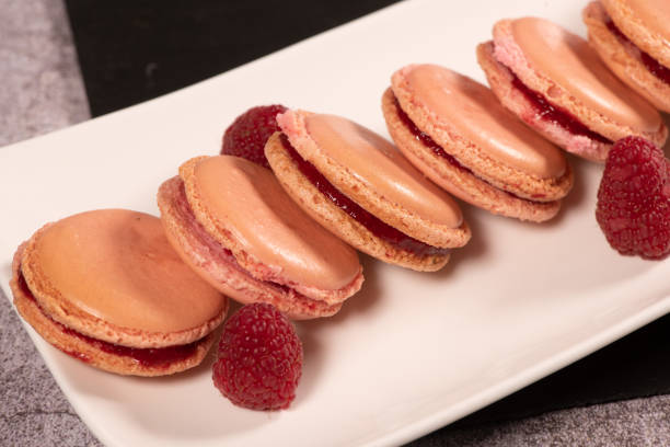 istock Pastry, Macaroon recipe with raspberry cream filling 1363947148