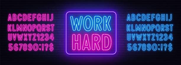 Work Hard neon lettering on brick wall background. Work Hard neon lettering on brick wall background. Inspirational glowing sign. Neon pink and blue alphabet. work motivational quotes stock illustrations