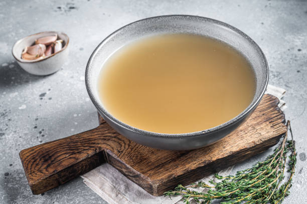 istock Bone meat chicken broth in a plate. Gray background. Top view 1363954550