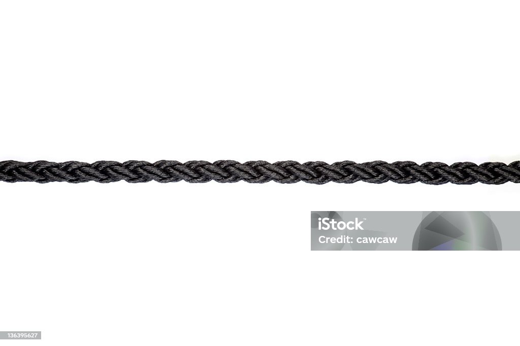 close up of single black rope line on white background close up black rope line Rope Stock Photo