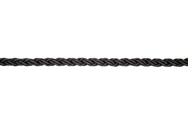 close up of single black rope line on white background stock photo